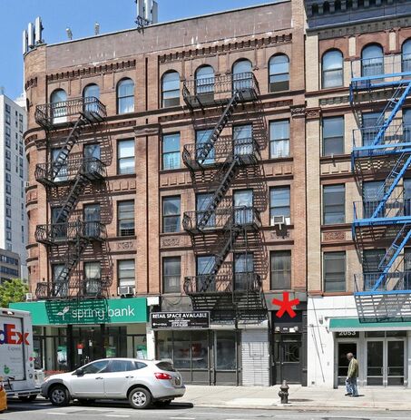 5 story building with fire escapes at 2051 8th Avenue