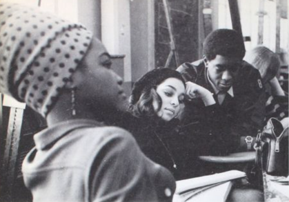 Four students lounging in class 1969 Yearbook